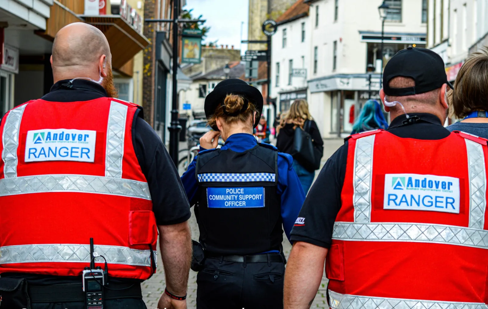 Town rangers and police officers patrolling a high street together